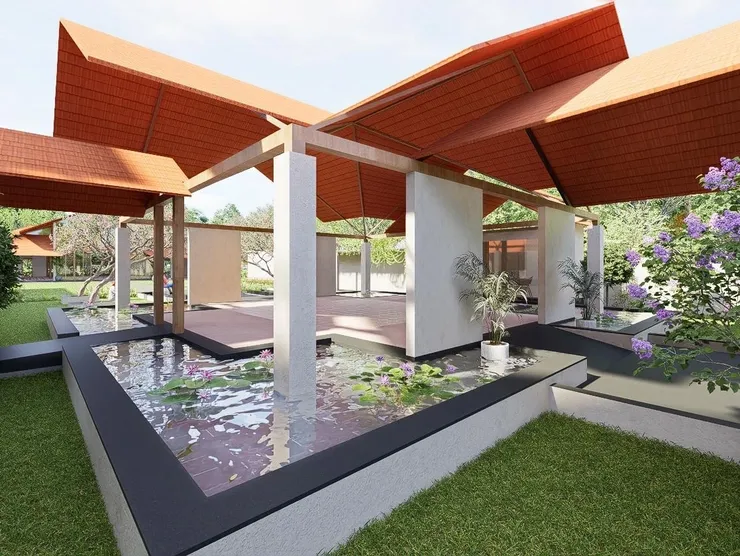 The Lily Cascade pavilion surrounded by water features, lotus plants and lush greenery